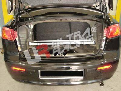 [Obr.: 10/55/74/9-mitsubishi-lancer-07-ultra-r-4-point-rear-trunk-brace-1696469259.jpg]